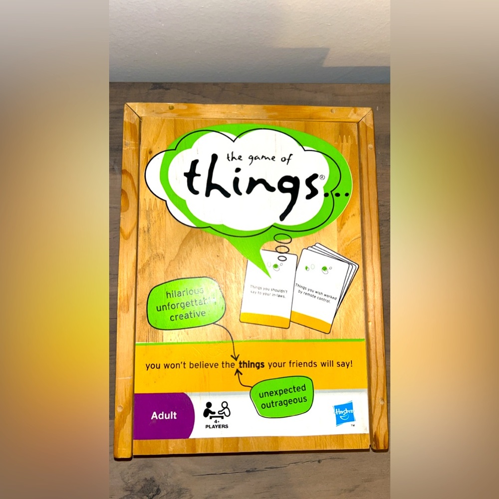 The game of things, has all pieces and is in a wooden box, card game